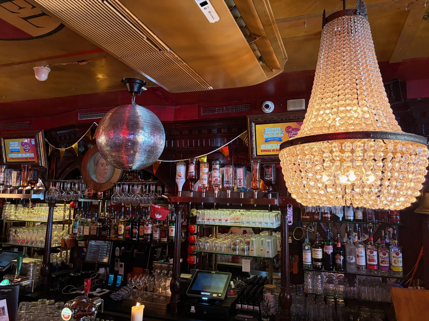 The bar with the crystal chandelier and the disco ball