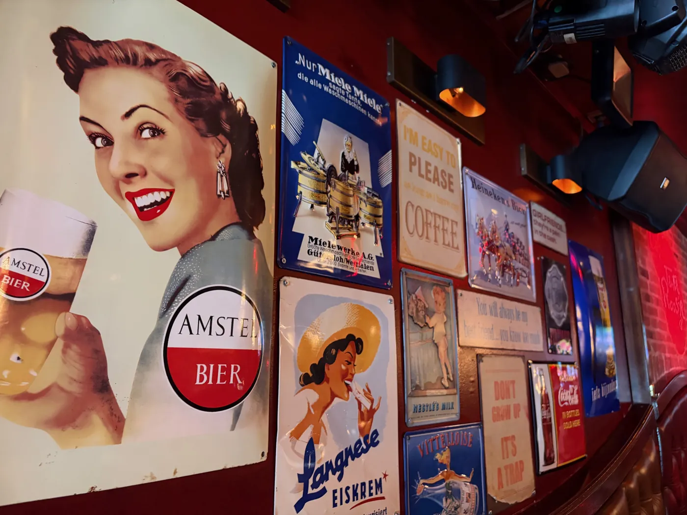 The wall full of enamel advertising signs